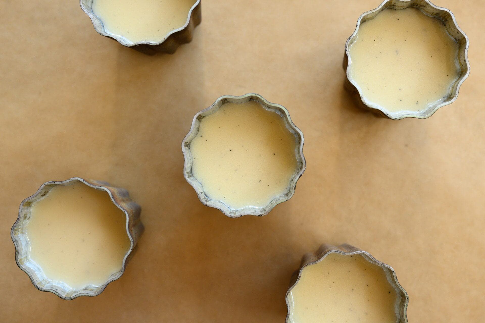 Canelé mold filled with batter