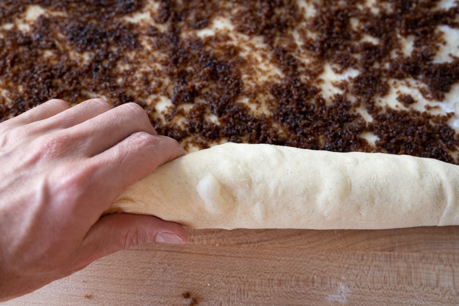 Rolling up sourdough cardamom rolls