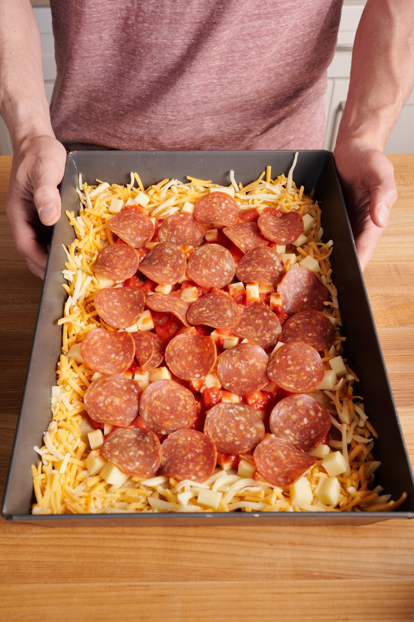 The final assembled Detroit-style pizza ready for baking.
