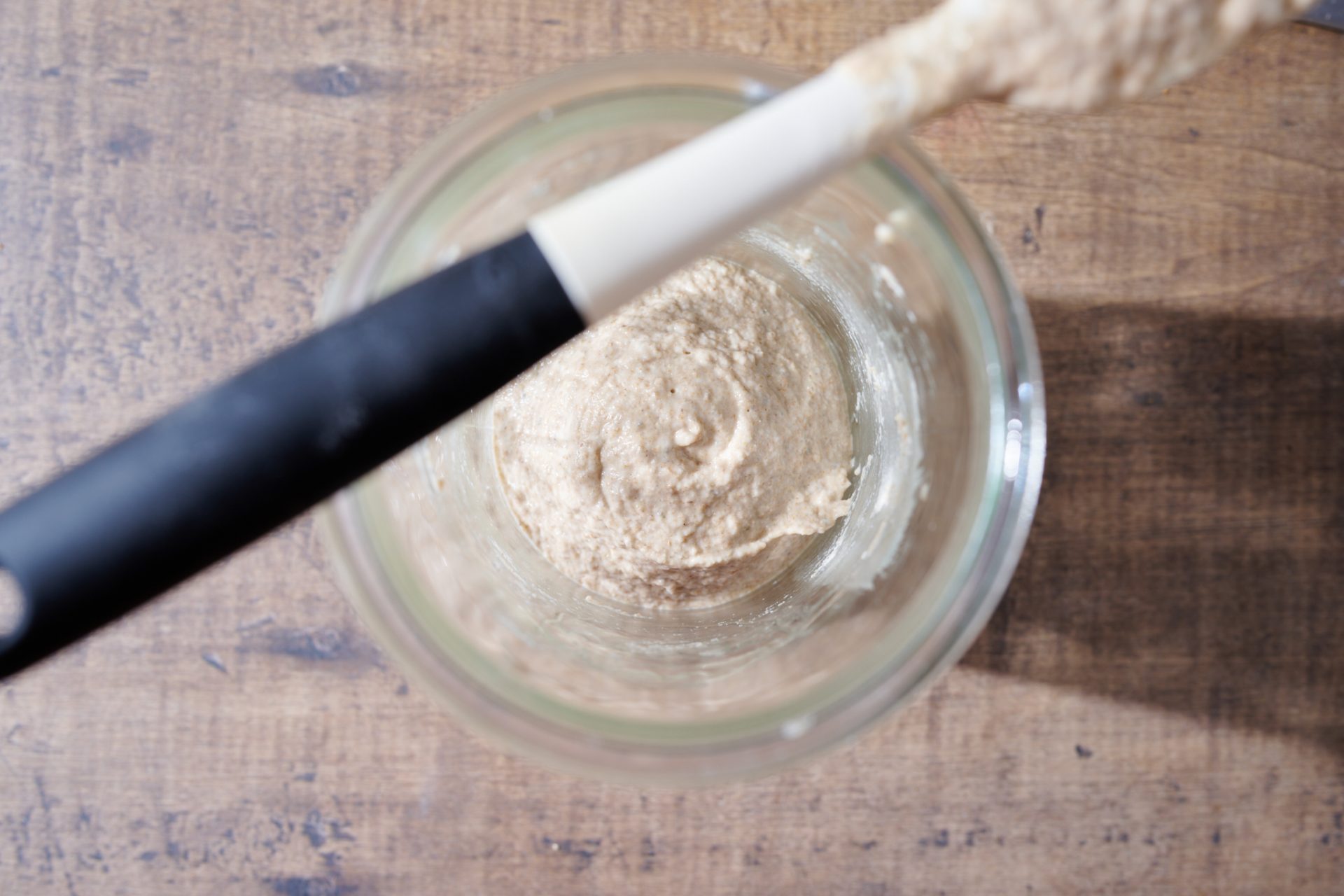 Newly fed sourdough starter after removing it from the fridge