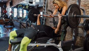 bench press man woman barbell