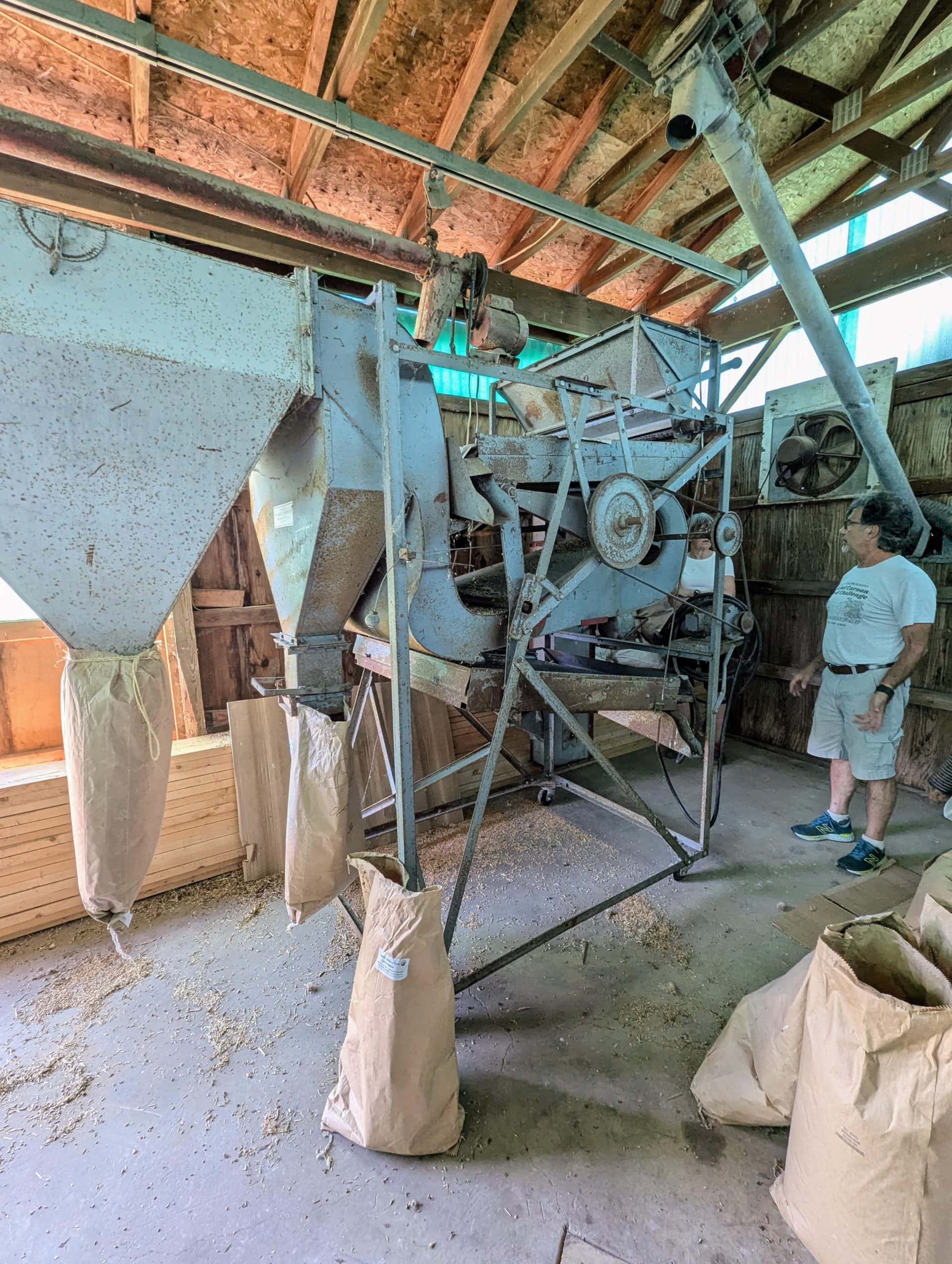 T. Lyle Ferdeber explaining how his seed cleaner works.