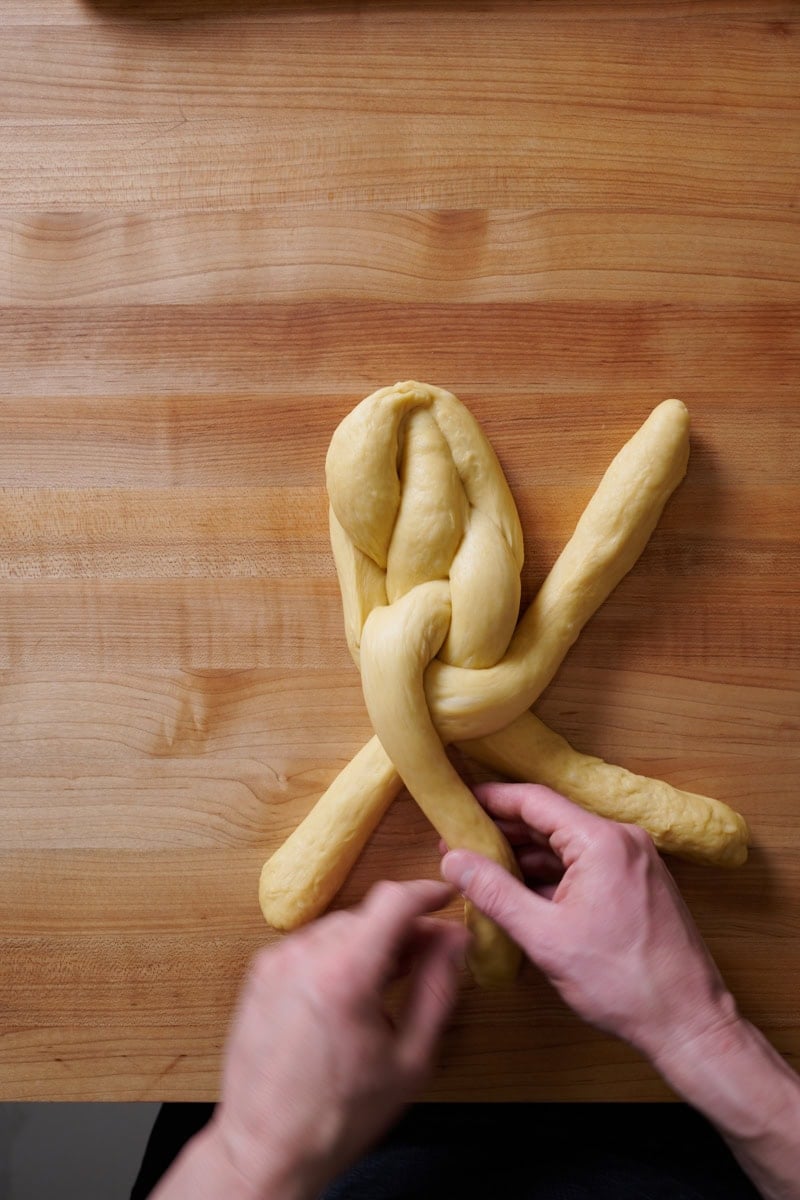 Braiding a 4 strand challah.