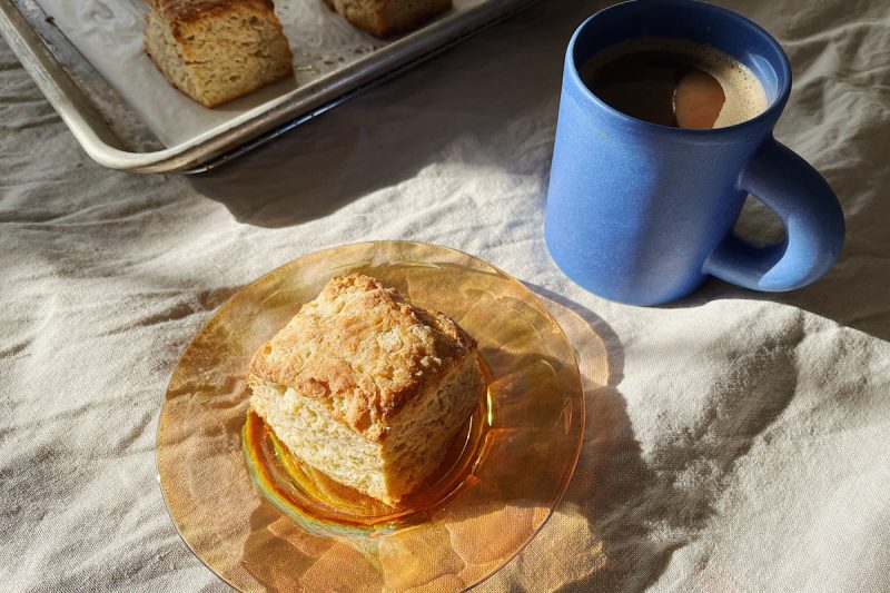 A sourdough discard biscuit sitting on a plate