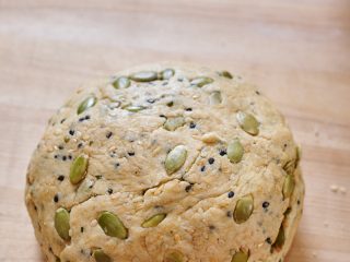 Seeded sourdough discard cracker dough mixed.