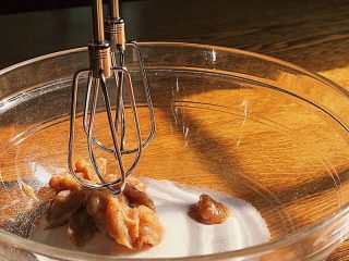Mixing sourdough discard plum cake ingredients.