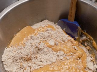 Combining the wet and dry ingredients for pumpkin scones.